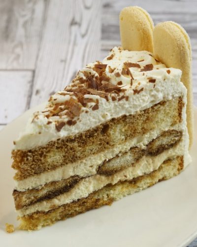 savor the classic flavor of a traditional tiramisu slice at Mia's Bakery.