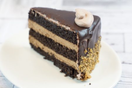 savor the classic flavor of a homemade chocolate mousse cake slice at Mia's Bakery.