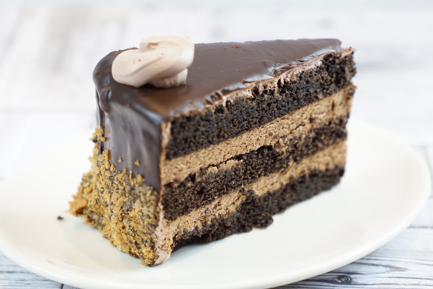 chocolate mousse cake slice 2 savor the classic flavor of a homemade chocolate mousse cake slice at Mia's Bakery.