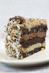 savor the classic flavor of a traditional german chocolate cake slice at Mia's Bakery.