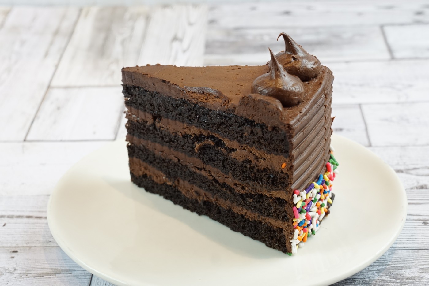 chocolate fudge cake slice savor the classic flavor of a homemade chocolate fudge cake slice at Mia's Bakery.
