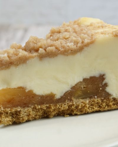 savor the classic flavor of a traditional New York style apple cheesecake slice at Mia's Bakery.