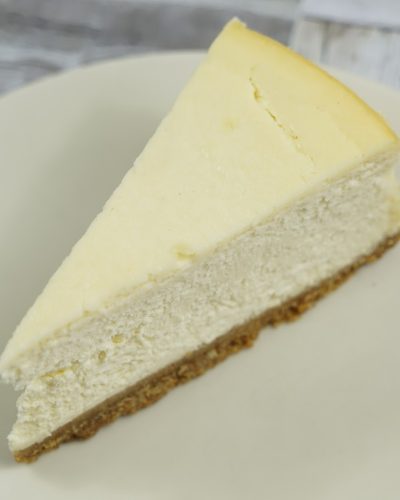 savor the classic flavor of a traditional New York cheesecake slice at Mia's Bakery.