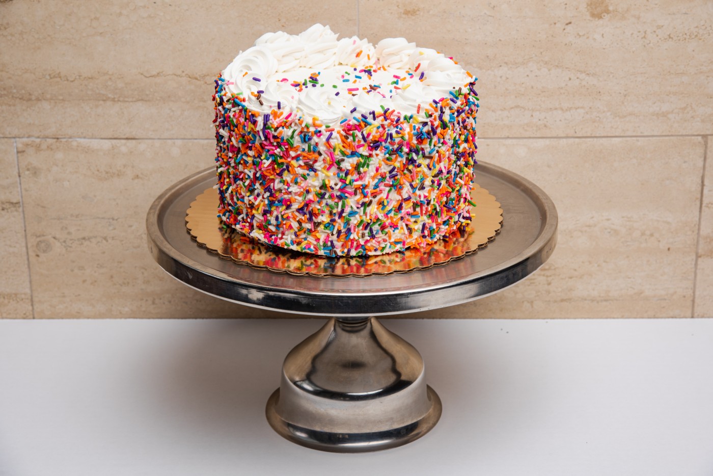 rainbow cake savor the classic flavor of a traditional rainbow cake at Mia's Bakery.