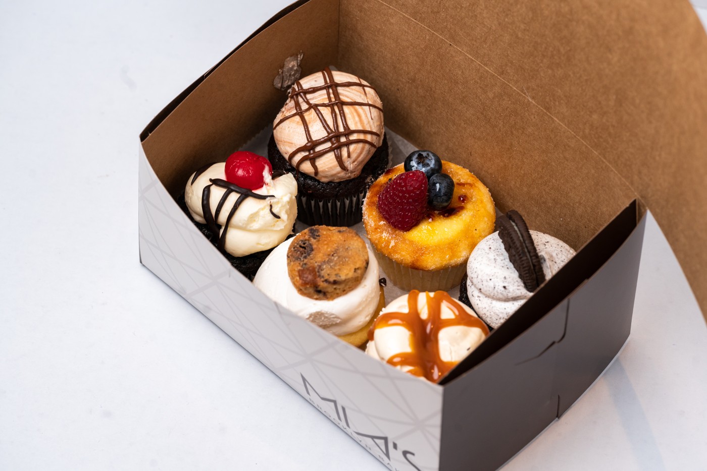 Assorted Cupcakes box 6-pack Assorted Cupcakes box 6-pack from Mia's Bakery