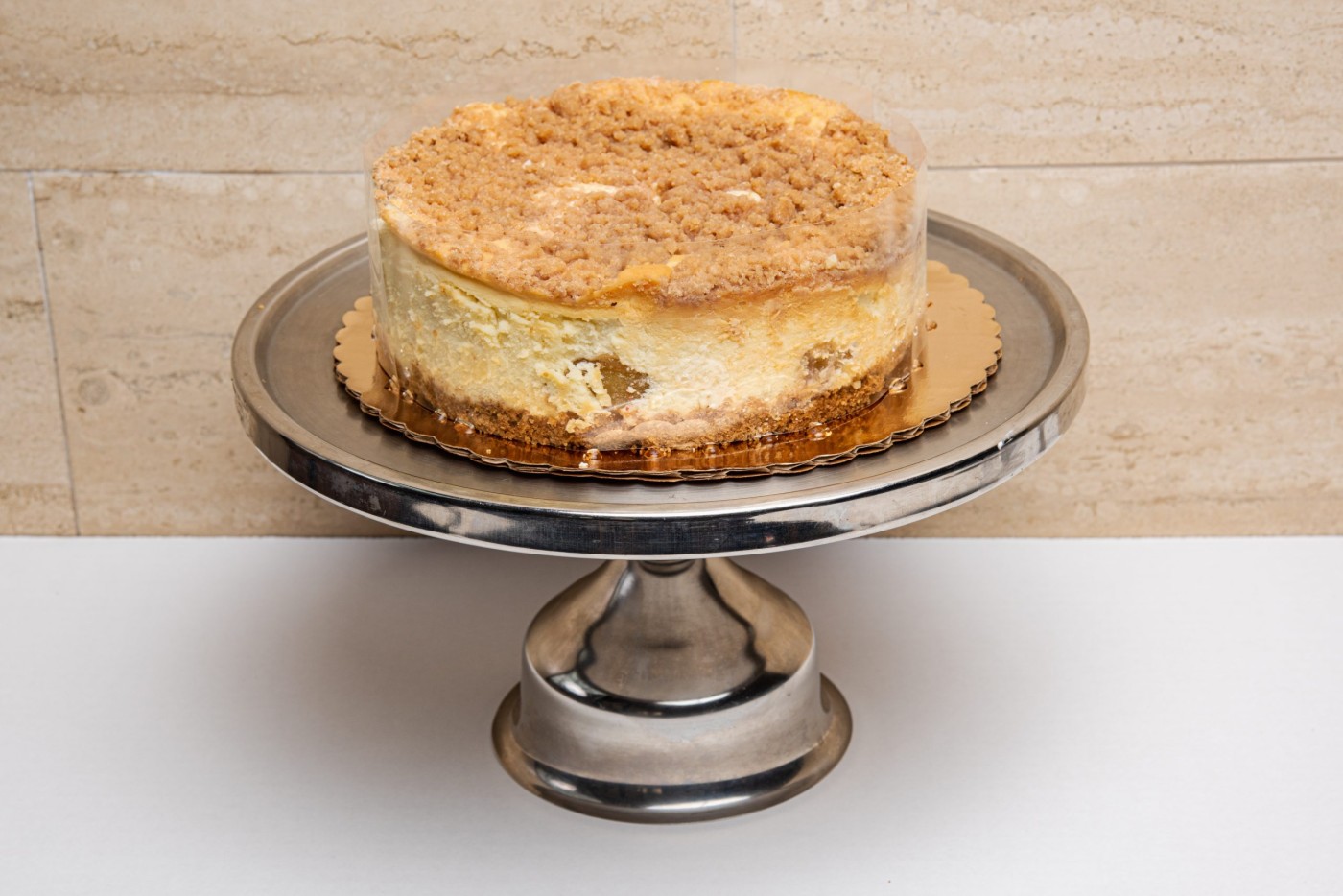apple cheesecake savor the classic flavor of a traditional New York style apple cheesecake at Mia's Bakery.