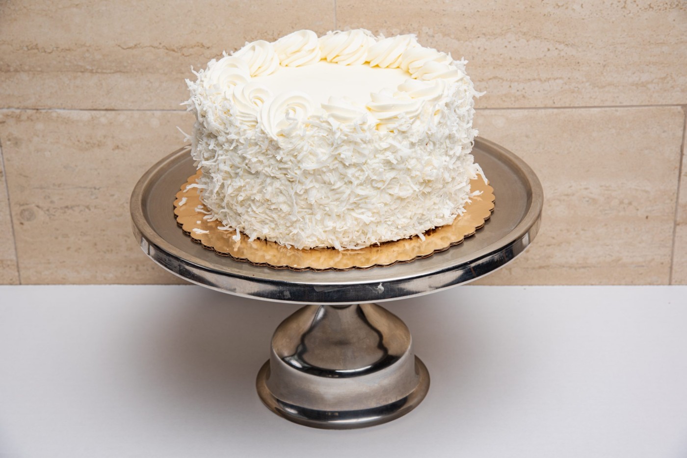 coconut cake savor the classic flavor of a traditional coconut cake at Mia's Bakery.