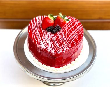 savor the classic flavor of a chocolate raspberry heart cake at Mia's Bakery.