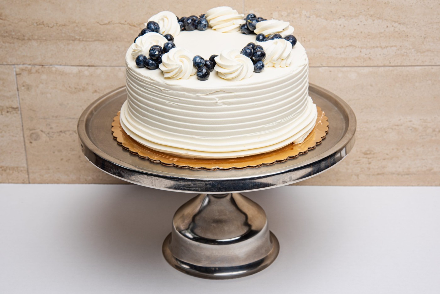 lemon blueberry cake savor the classic flavor of a traditional lemon blueberry cake at Mia's Bakery.