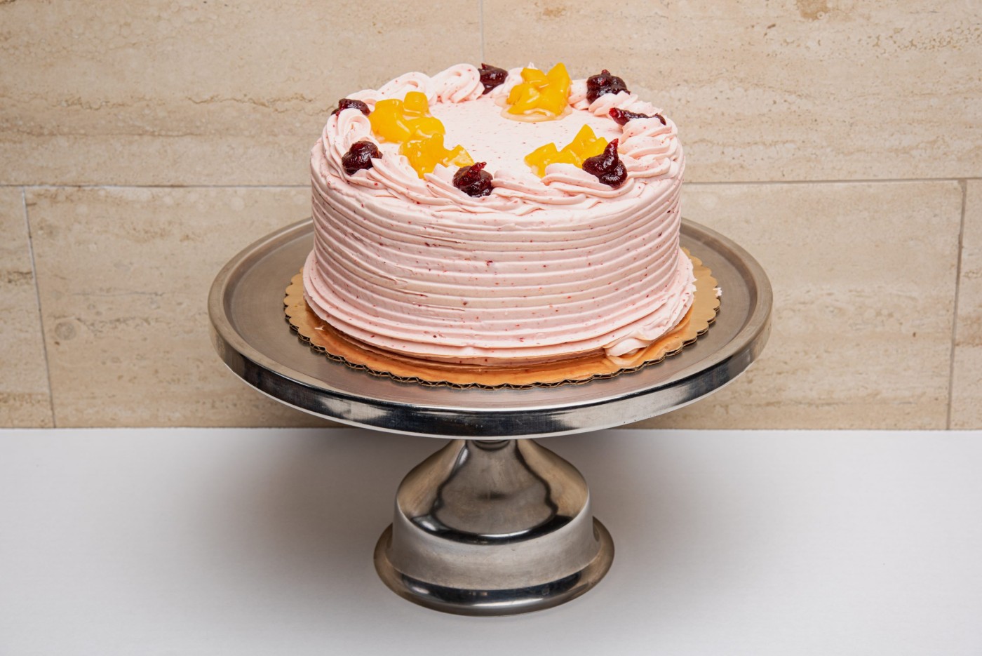peach raspberry cake savor the classic flavor of a traditional peach raspberry cake at Mia's Bakery.