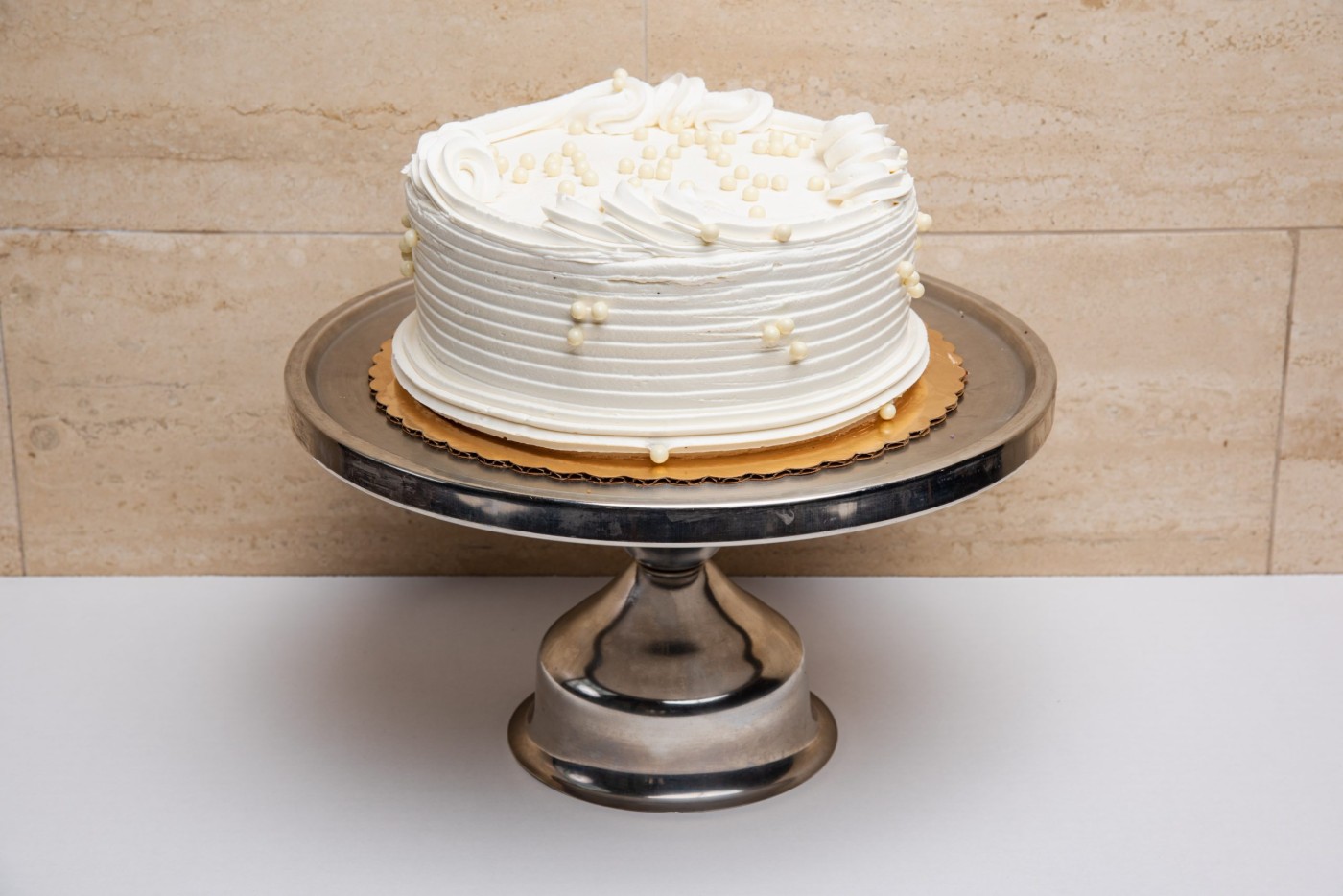 vanilla bean cake savor the classic flavor of a traditional vanilla bean cake at Mia's Bakery.