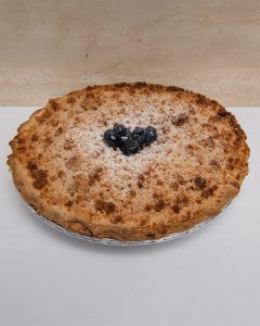 savor the classic flavor of a traditional blueberry crumb pie at Mia's Bakery.