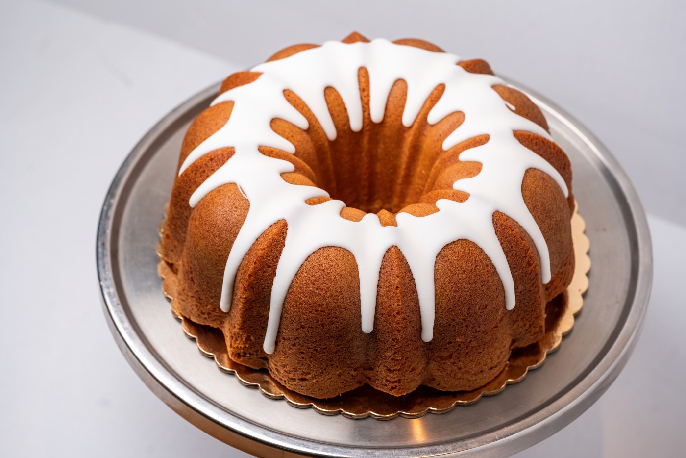 Lemon Bundt Cake savor the classic flavor of a homemade lemon bundt cake at Mia's Bakery.
