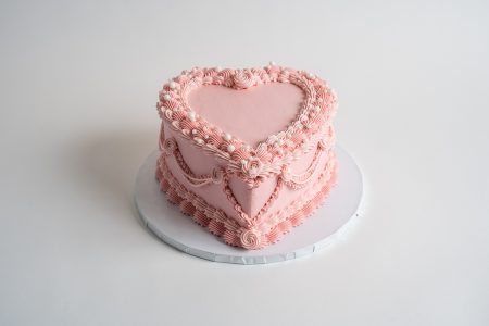 savor the flavor of custom Pink Vintage Heart Cake at Mia's Bakery.