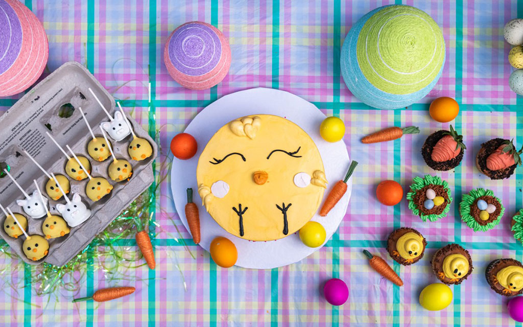 Best Easter desserts featuring yellow bunny cake, chocolate nest cupcakes, and decorated cookies on festive spring table